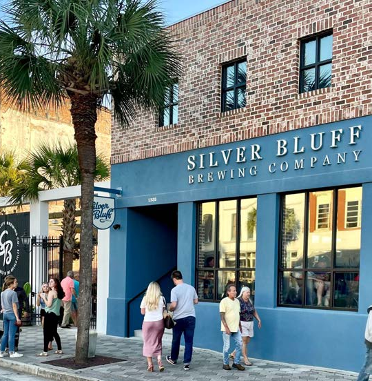 Simplistic metal signage, historic brick and floor to ceiling windows engage pedestrians on the street. This building is also partially elevated, similar to many future buildings in Crystal River.
