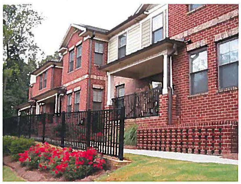 Figure 19-6.8-4: Facade treatment with covered porches, changes in wall plane, and distinct changes in color and texture