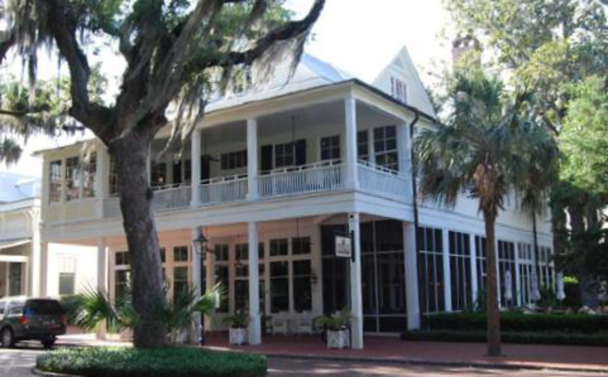 Main street mixed-use building with a two-story gallery