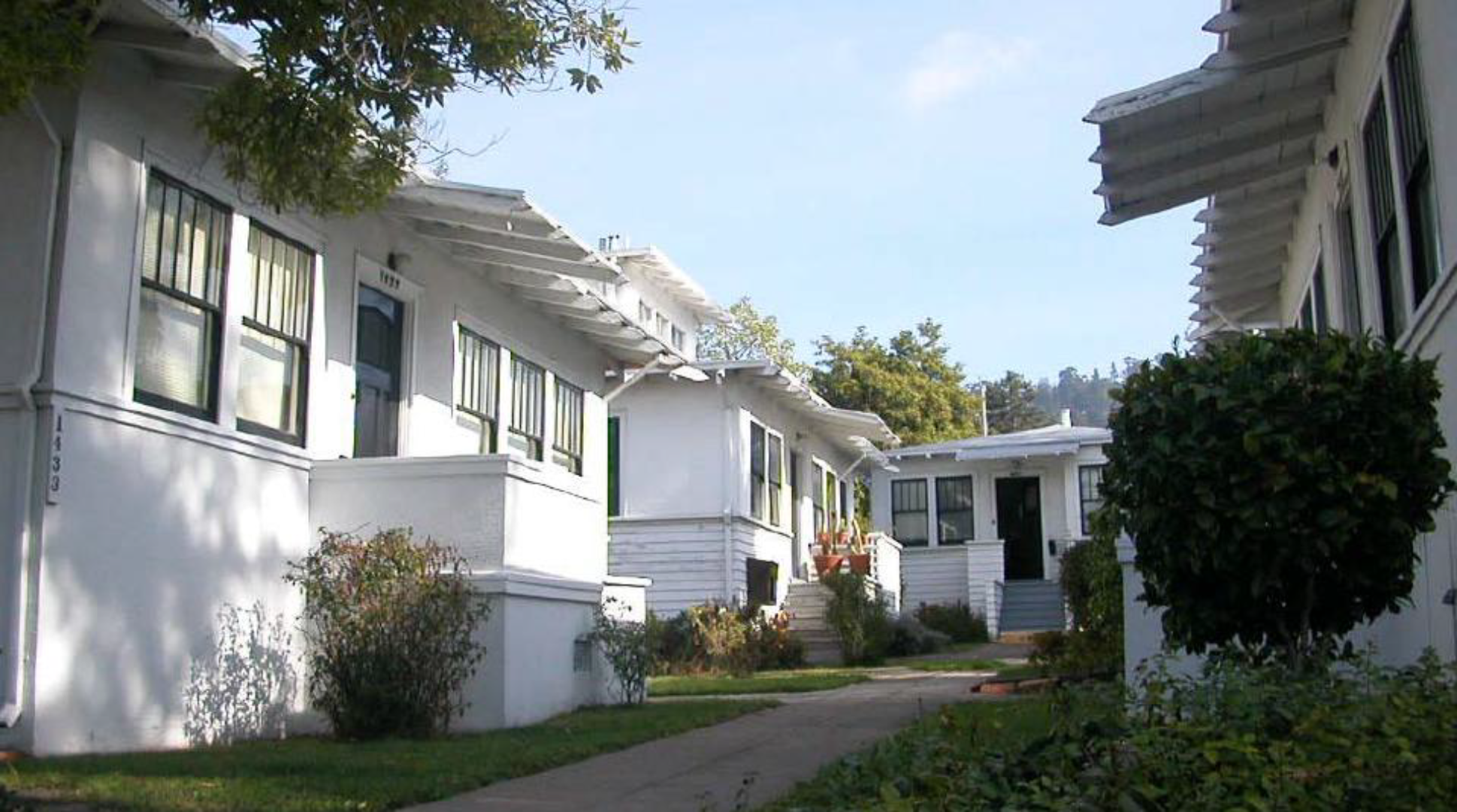 Prairie-style cottage court with raised stoop entries