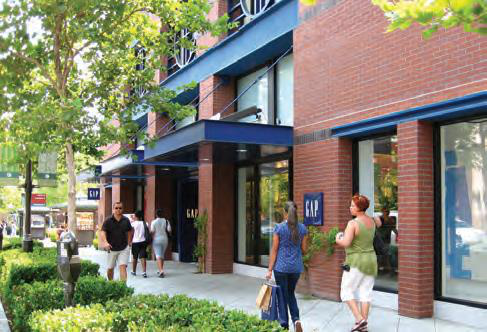 Image 20.225-11 Storefront Design Windows, scale and street-adjacent location of storefronts promotes pedestrian activity.