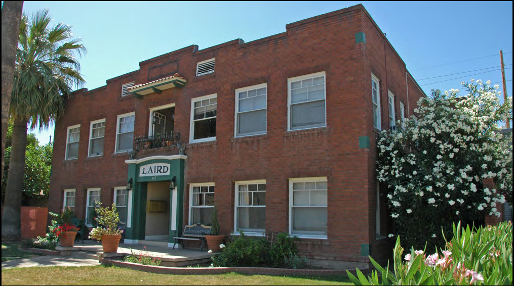 An apartment house with a recessed stoop.