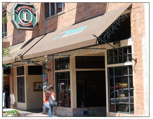 Awning with decorative supports and open end.