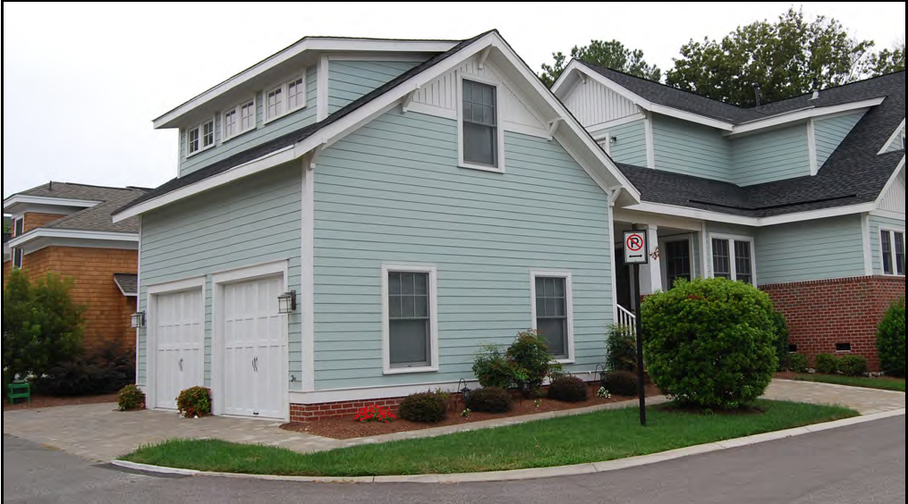 One-and-a-half-story carriage house connected to main house by a breezeway.