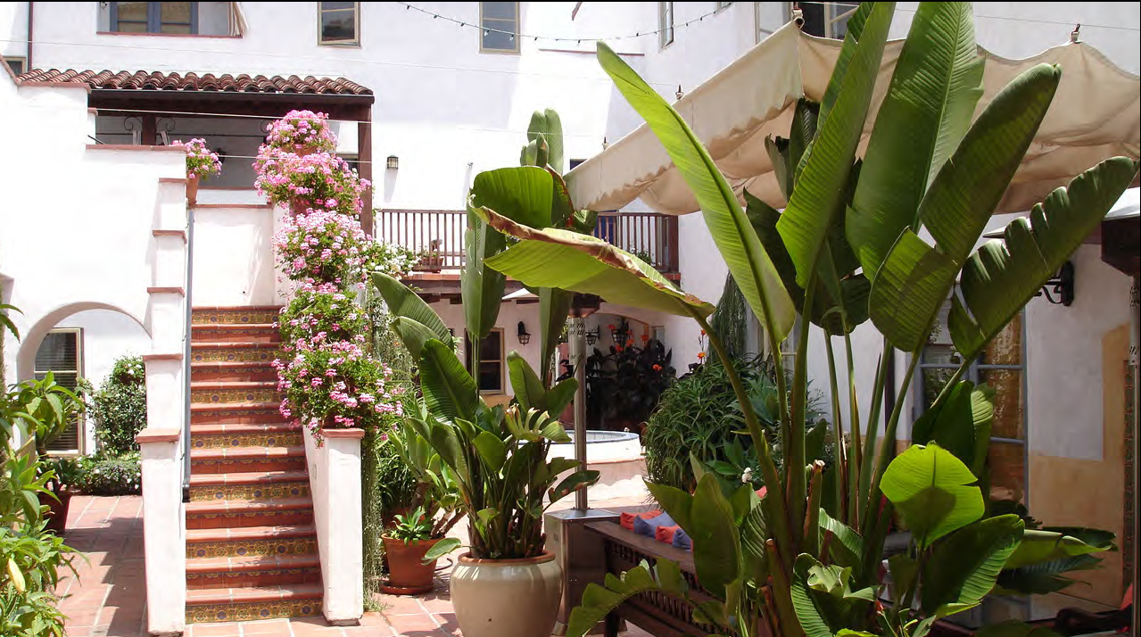 A courtyard building with all units accessed from a central courtyard that provides communal open space.
