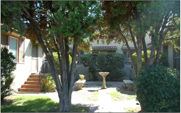 A courtyard with communal seating for residents and guest.