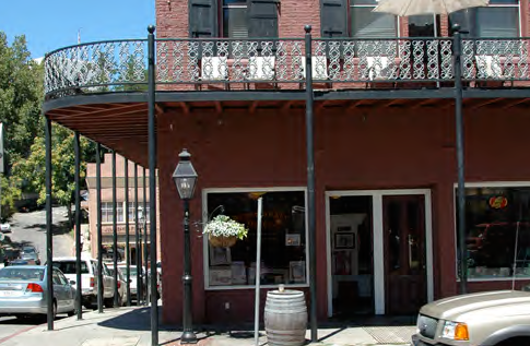 A one-story gallery with second floor access.