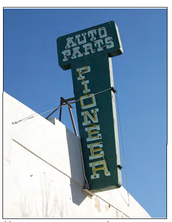 Marquee sign projecting above parapet.