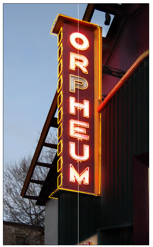 Lit marquee sign; neon lettering used in conjunction with painted lettering.