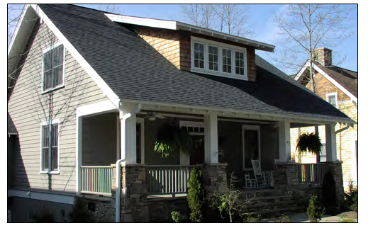 One-and-a-half story cottage house with integral porch.