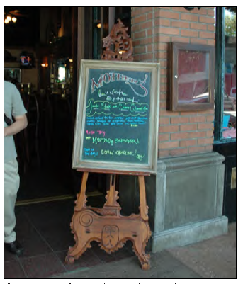 Ornamental wood stand and slate sign.