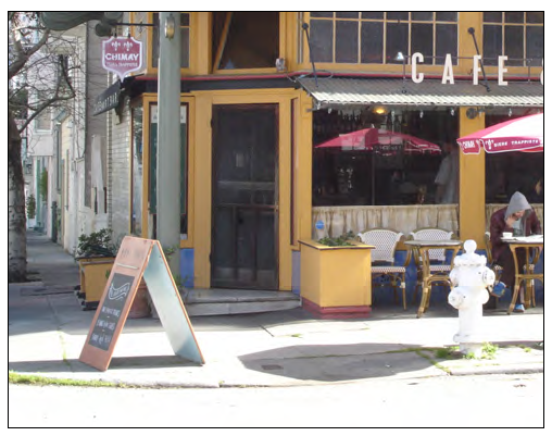 Sidewalk sign complements primary signage.