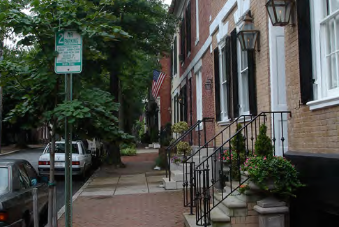 These stoops on townhouses with slightly recessed entries and a minimum setback allow the steps to engage the street.