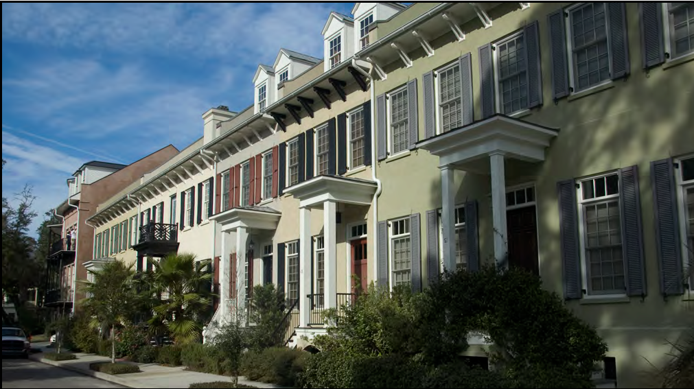 Individual stoops and dormers help to break down the overall massing of this row of townhouses.