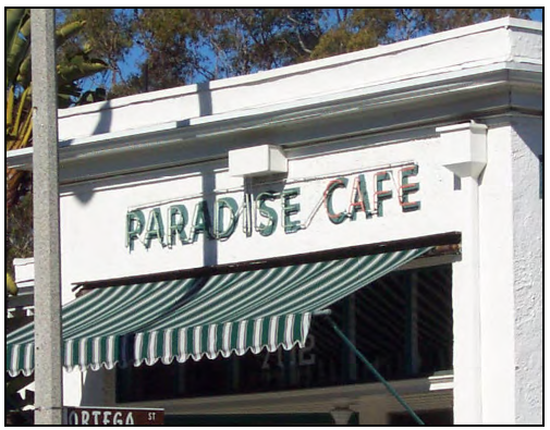 Painted wall sign with neon lettering.