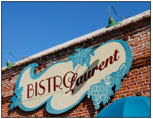 Painted wall sign applied to facade.