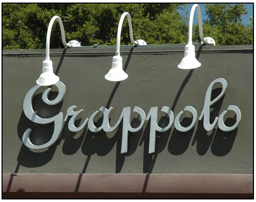 Metal wall sign, offset from building facade.