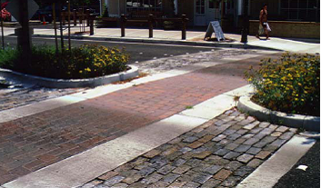 Textured paving creates visual interest, which slows drivers and makes pedestrians feel more comfortable when crossing.