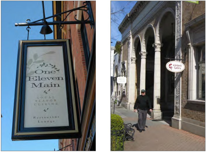 Example — Rectangular projecting sign with painted relief and decorative bracket.