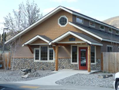 Figure 44. Acceptable Facade Detailing Example for Outside the Historic Core This building uses decorative stone and shinglework, decorative windows, and a decorative entry feature.
