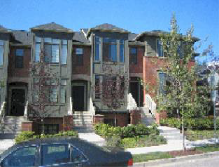 Figure 11. An Acceptable Townhouse Building Note the landscaped front yards and individual walkways and entries. The internal units each have distinct but identical windows and roof forms. The outside unit is differentiated through the use of building materials, window design, unit size, and facade detailing.