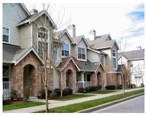 Figure 15.540.060(A). Desirable townhouse example. With units fronting on the street and garages placed to the rear accessible from an alley or shared driveway.