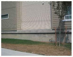 Figure 15.570.050(C). Foundation plantings would be required along the exposed concrete foundation.